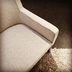 Image showing Beige textile armchair on a carpet