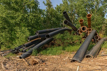 Image showing Rusty metal pipes in the forest