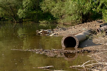 Image showing Rusty metal pipes in the forest