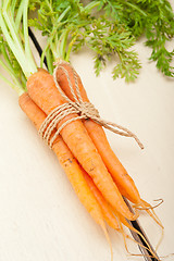 Image showing baby carrots bunch tied with rope