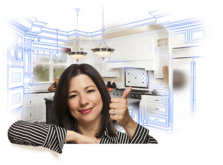 Image showing Hispanic Woman with Thumbs Up, Kitchen Drawing and Photo Behind