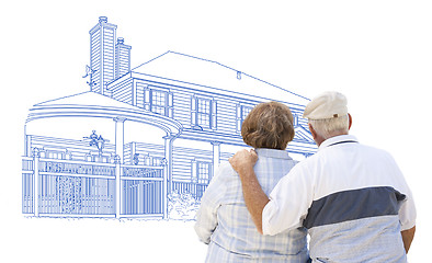 Image showing Embracing Senior Couple Looking At House Drawing on White