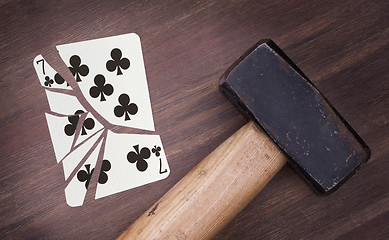 Image showing Hammer with a broken card, seven of clubs