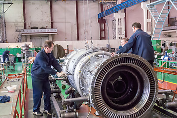 Image showing Workers assemble turbine of aviation engine