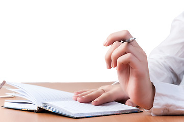 Image showing Hands of reflected business lady over organizer