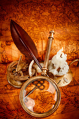 Image showing Vintage still life. Vintage items on ancient map.