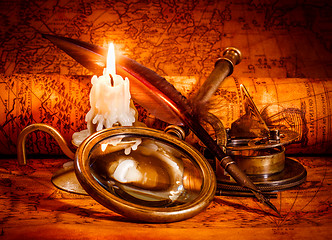 Image showing Vintage still life. Vintage items on ancient map.