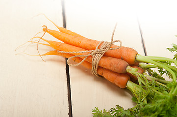 Image showing baby carrots bunch tied with rope