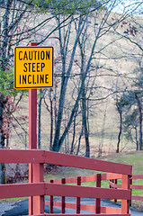 Image showing caution steep incline warning yellow sign