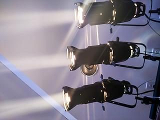 Image showing multiple spotlights on a theatre stage lighting rig