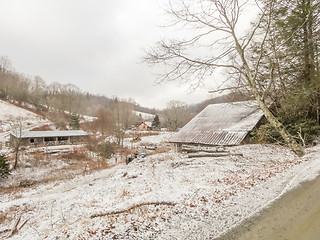 Image showing winter shack and mountain  farm road