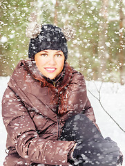 Image showing Portrait of the charming young woman in winter outdoors 