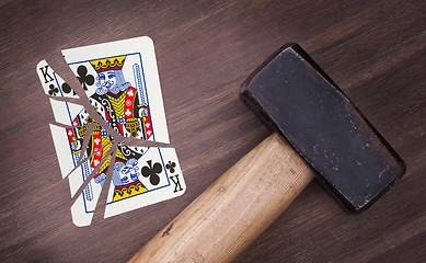 Image showing Hammer with a broken card, king of clubs