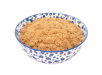 Image showing Light brown soft / muscovado sugar in a blue and white china bow