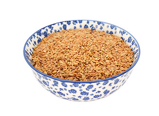 Image showing Golden linseed or flax seeds in a blue and white china bowl