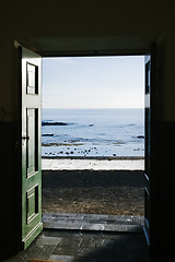 Image showing Ocean trough the door