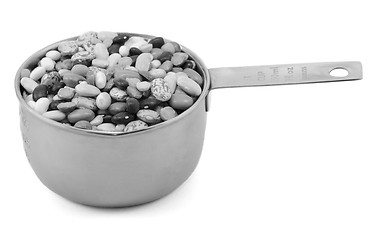 Image showing Mixed dried beans in a metal cup measure