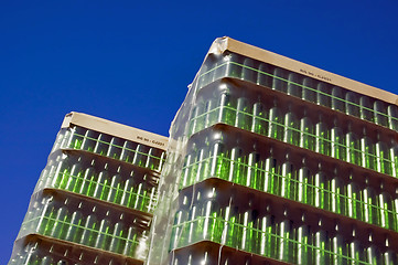 Image showing Stack of green glass bottles