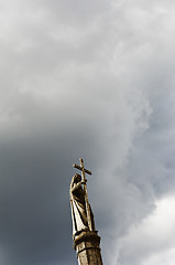 Image showing Saint holding a cross