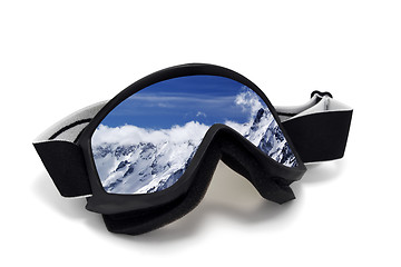 Image showing Ski goggles with reflection of cloudy mountains