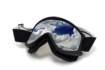 Image showing Ski goggles with reflection of cloudy mountains