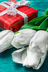 Image showing gift for your favorite background tulips