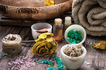 Image showing bronze bowl with water and accessories spa treatments