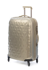 Image showing Beige plastic suitcase on wheels for travel.