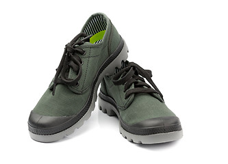 Image showing Fashionable pair of green sneakers. Isolate on white.