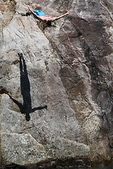 Image showing Man jumping fish in water