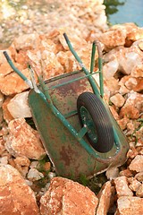 Image showing Wheelbarrow on red rocks