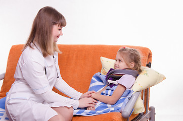 Image showing Doctor comforting a sick child