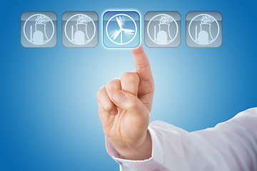 Image showing Finger Selecting Wind Energy Among Nuclear Icons