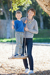 Image showing family at swings