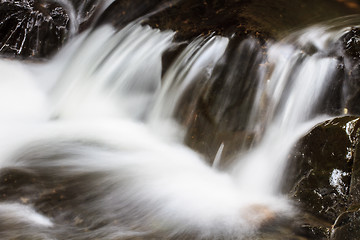 Image showing waterfall and rocks covered with moss