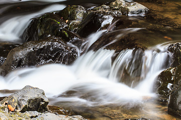 Image showing waterfall and rocks covered with moss