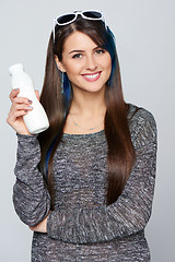 Image showing Healthy woman eating yoghurt