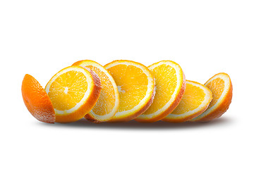 Image showing Falling slices of orange on white