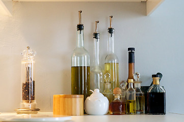 Image showing oil bottles on shelf