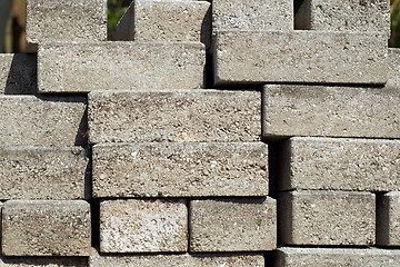 Image showing stacked building bricks outside in sunshine