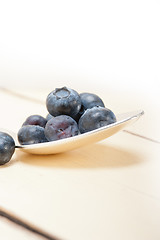 Image showing fresh blueberry on silver spoon