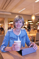 Image showing Woman sitting in the cafe