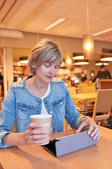 Image showing Woman sitting in the cafe