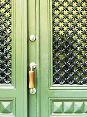 Image showing Green door with decorative grid