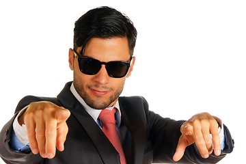 Image showing Businessman with sunglasses pointing