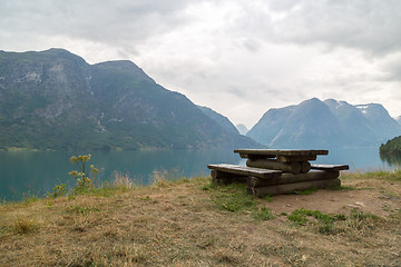 Image showing Wooden bench in fjord