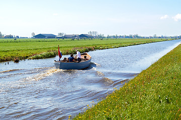 Image showing Typical blue motor boat  in the Rural countryside  Netherlands