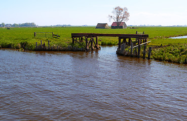 Image showing Dutch countryside with waterway and gateway