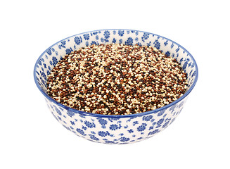 Image showing Mixed red, white and black quinoa in a blue and white china bowl