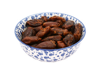 Image showing Whole dates in a blue and white china bowl